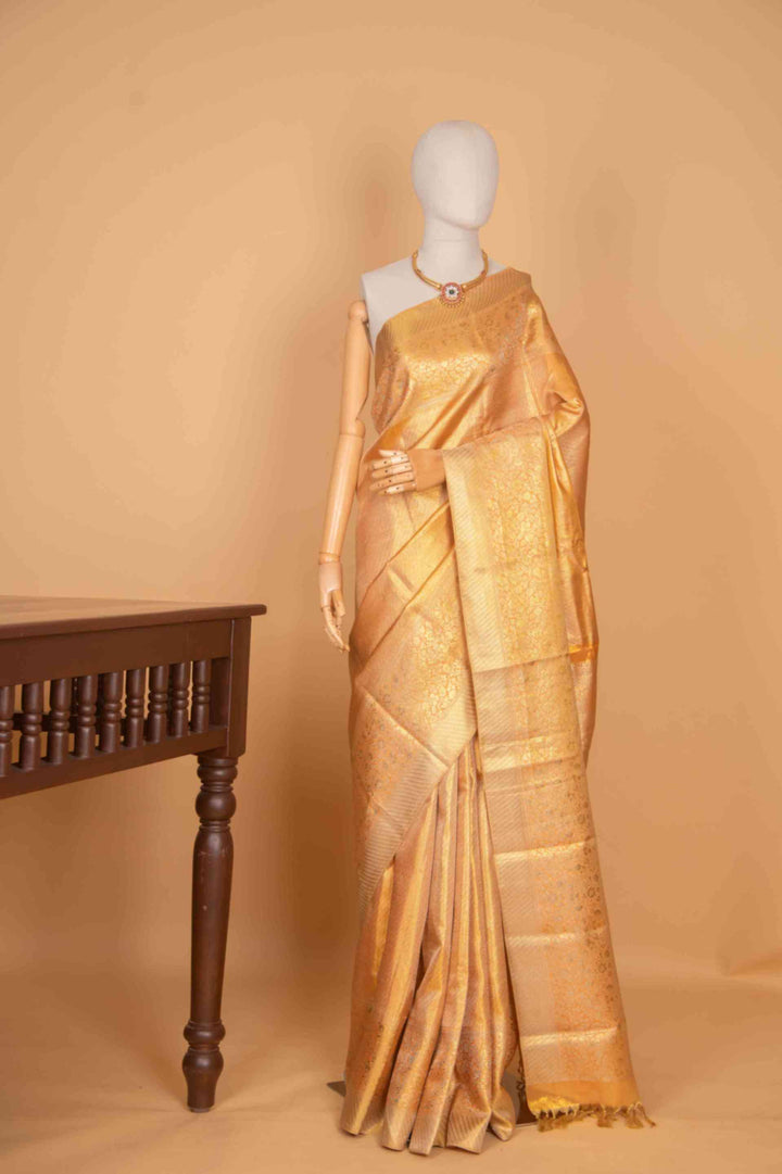 Peachish gold tissue silk saree