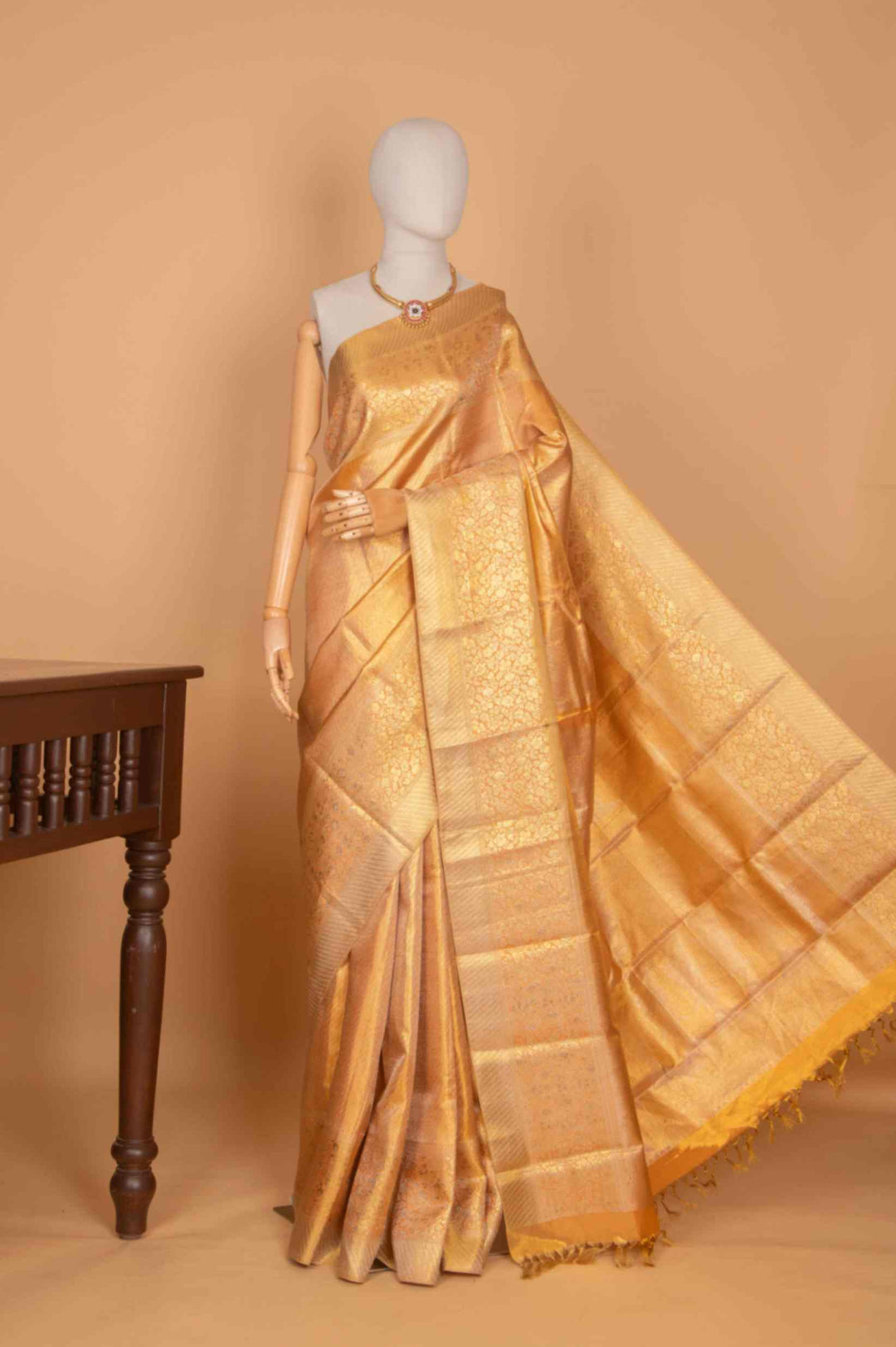 Peachish gold tissue silk saree