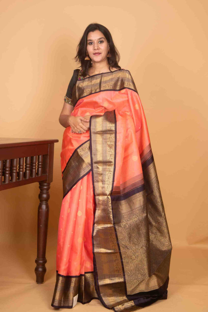 Peach and black korvai silk saree