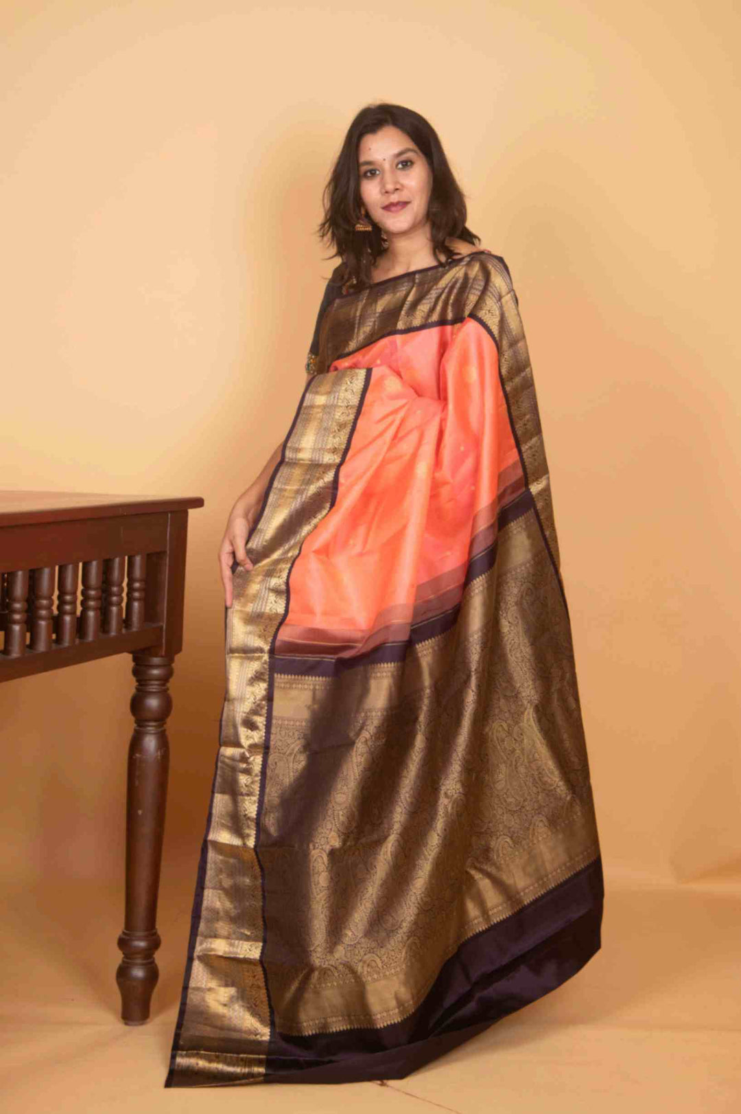 Peach and black korvai silk saree
