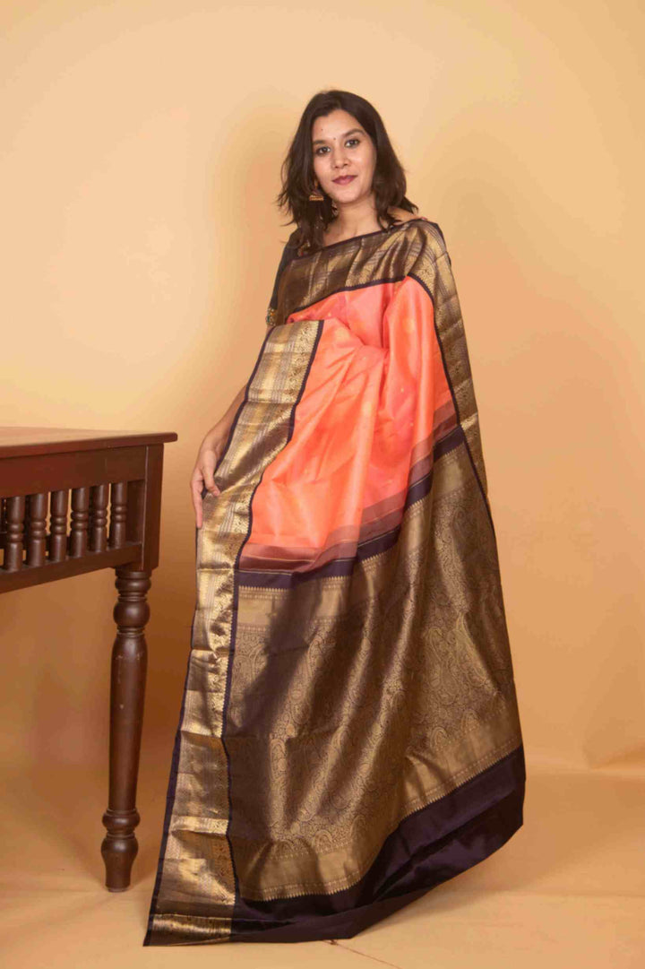 Peach and black korvai silk saree