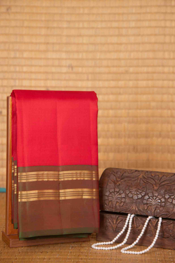 Tomato red and mandhulir green pure silk saree