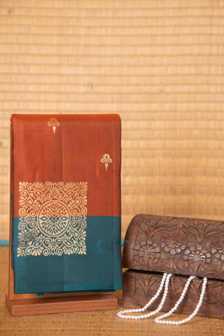 Rust and teal pure silk saree