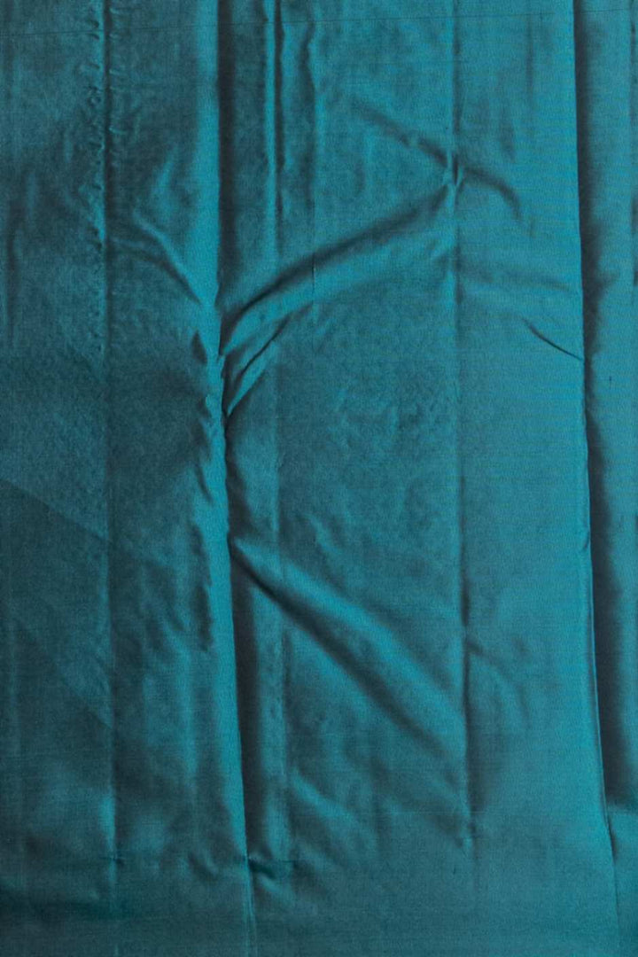 Rust and teal pure silk saree