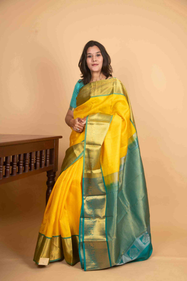 Yellow and teal silk saree