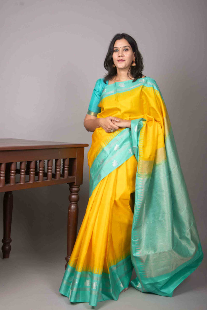 Yellow and turquoise korvai silk saree