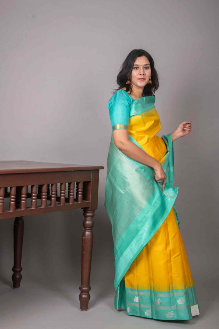 Yellow and turquoise korvai silk saree