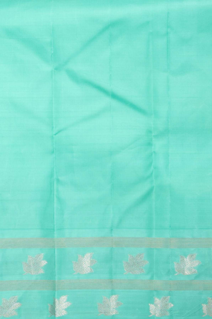 Yellow and turquoise korvai silk saree
