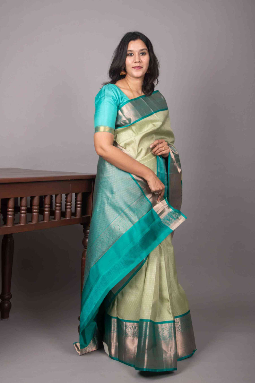 Sage green and teal green korvai silk saree