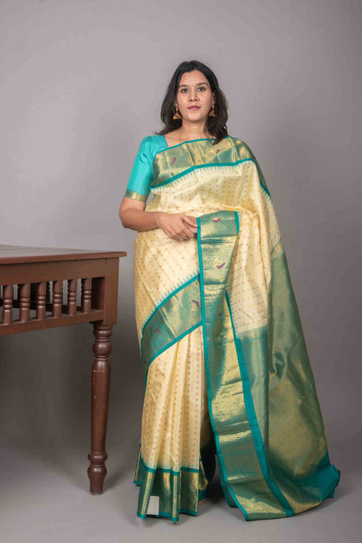Offwhite and teal korvai silk saree