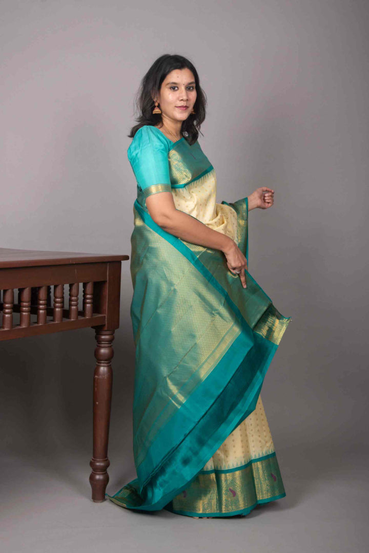 Offwhite and teal korvai silk saree