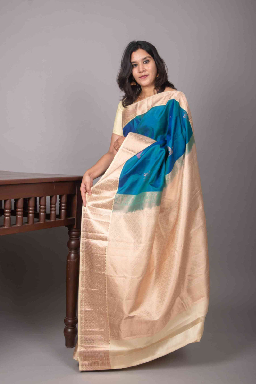 Peacock blue and cream korvai silk saree