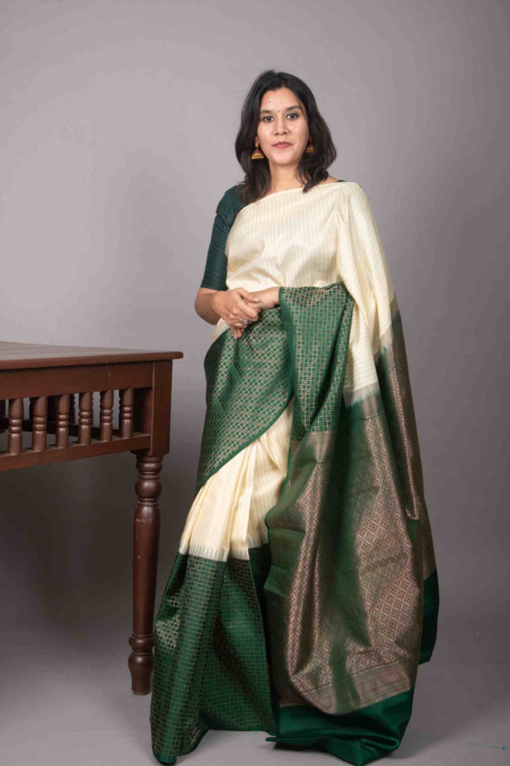 Cream and green half and half silk saree