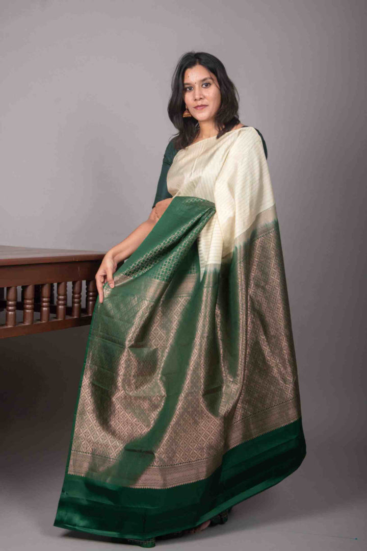 Cream and green half and half silk saree