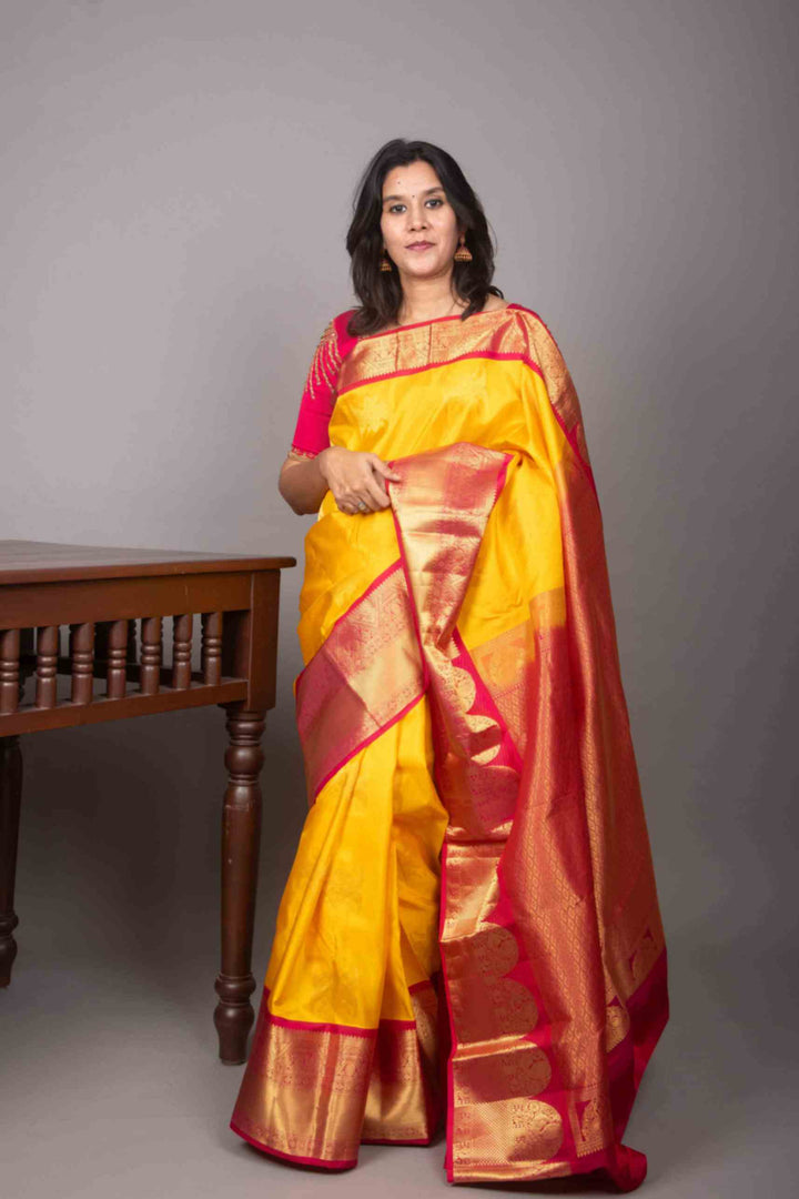 Yellow and magenta korvai silk saree