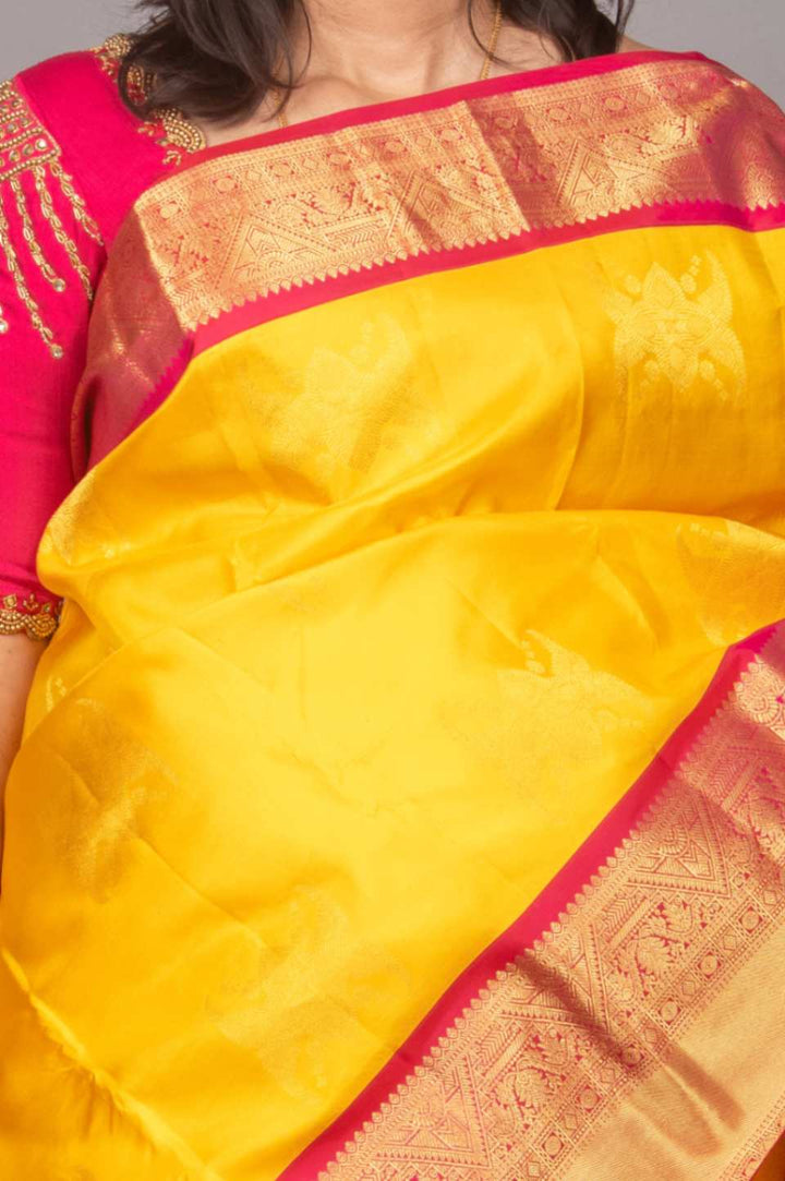 Yellow and magenta korvai silk saree