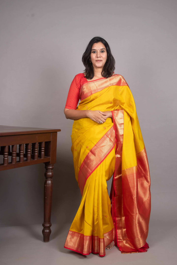 Saffron Yellow and Red Needle Embroidery Fusion silk saree