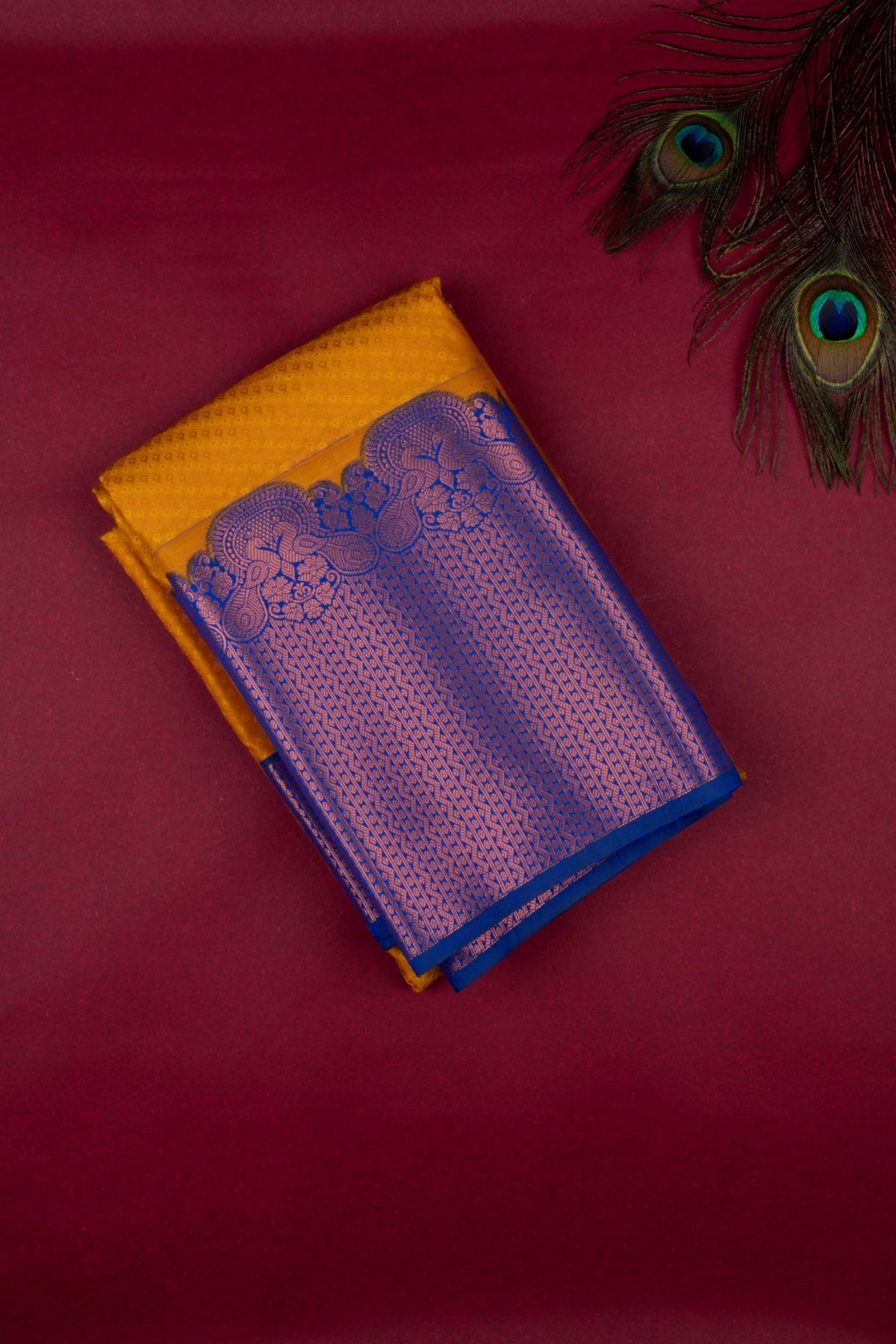 Mustard and blue turning semi silk saree