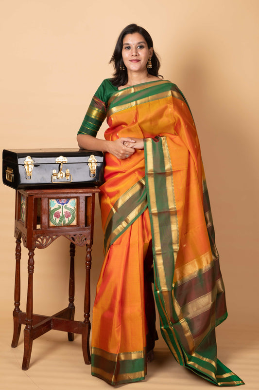 Dual tone orange small border silk saree