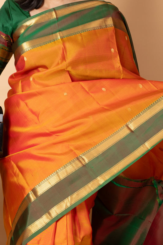 Dual tone orange small border silk saree