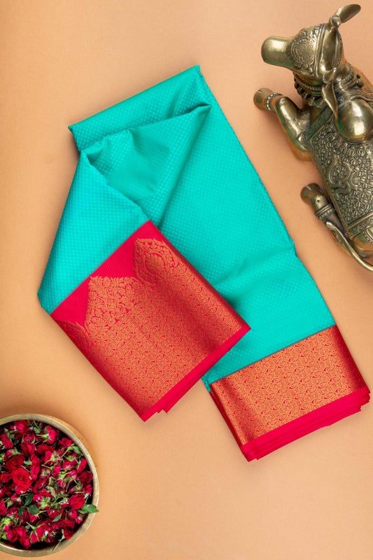 Aqua green and reddish pink semi silk saree