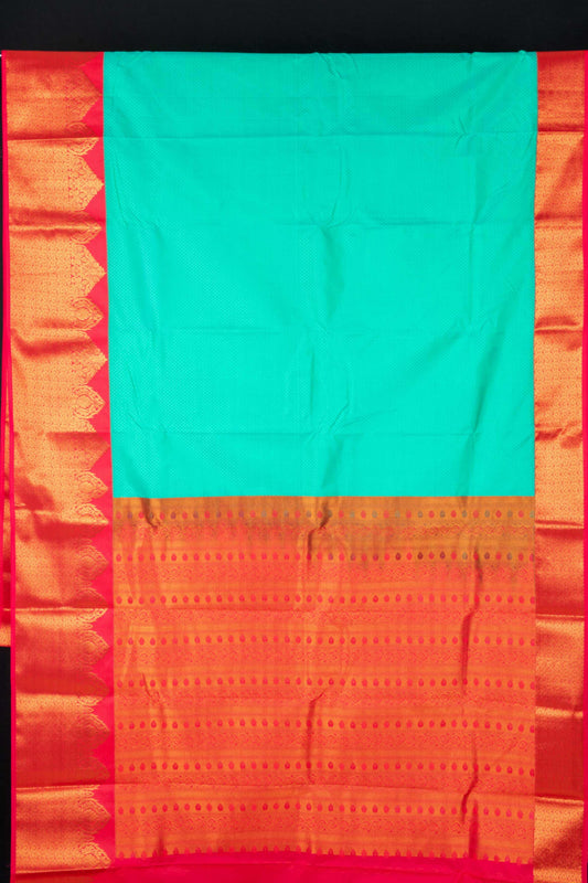 Aqua green and reddish pink semi silk saree